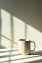 Geometric ceramic mug showcasing clean lines and soft shadows in minimalistic setting Royalty Free Stock Photo