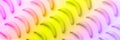 Geometric colorful fruit pattern. Bananas over rainbow gradient background. Banner. Top view. Pop art design, creative summer