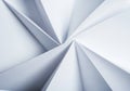 Geometric composition of white folded paper creating sharp, triangular patterns in a Royalty Free Stock Photo