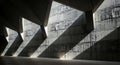 Geometric concrete architecture with strong light and shadow patterns Royalty Free Stock Photo