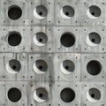 Geometric concrete wall with repeating circular cutouts Royalty Free Stock Photo