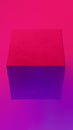 Geometric cube figure in vibrant neon colors.