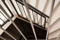 Looking down on a modern, black and white spiral staircase Royalty Free Stock Photo