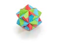 Geometric figure - dodecahedron made of colored paper on white b