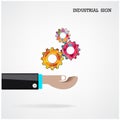 Geometric gears with businessman hand on background, industrial