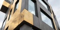 Geometric Gold Concrete Panel Facade Angled Detail Angled close-up view of a modern building facade featuring a pattern of Royalty Free Stock Photo