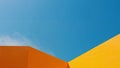 Geometric Junction. Azure Sky Meets Ocher Forms in a Minimalist Composition. Royalty Free Stock Photo