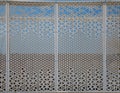 Mashrabiya screen pattern in metal panel over a building Royalty Free Stock Photo