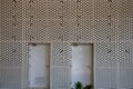 Mashrabiya screen pattern in metal panel over a building Royalty Free Stock Photo