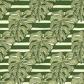 Geometric monstera leaf seamless pattern on stripes background. Modern tropical leaves philodendron plant silhouette backdrop