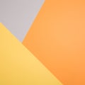 Geometric paper background in autumn tones. corners and triangles of gray, yellow, orange colors.