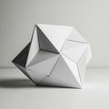 Geometric paper sculpture featuring interlocking triangular and polygonal facets, creating a Royalty Free Stock Photo