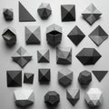 Geometric paper shapes arranged on a light-gray surface. The forms include triangle Royalty Free Stock Photo