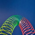 Geometric parabola from colored slinky toy.