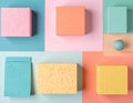 Geometric Pastel Colored Sponge Blocks and Sphere on Split Tone Background Royalty Free Stock Photo