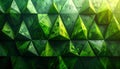 Geometric pattern of emerald green triangular facets with reflective surfaces Royalty Free Stock Photo