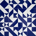 Geometric pattern featuring blue and white tiles arranged in a repetitive design. Each Royalty Free Stock Photo