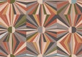 Geometric pattern featuring repeated circular designs with radial elements in earthy tones such as Royalty Free Stock Photo