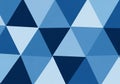 A geometric pattern featuring a series of blue triangles in varying shades. These triangles are Royalty Free Stock Photo