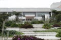 Geometric pattern of a Julio Mario Santo Domingo Public Library white stairways with green gardens, trees and nature architecture