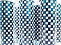 Geometric pattern. No illuminated cylinders with interspersed black and white checkered pattern Royalty Free Stock Photo