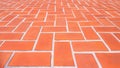 Geometric pattern of the old vintage orange brick pavement floor background, perspective view Royalty Free Stock Photo