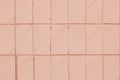 Geometric pattern of soft pink tile. Texture of orange pastel ceramic tiled. Light color backgrounds with square. Design of bathr