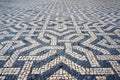 Geometric Pattern in Traditional Mosaic Paving Tiles on a Street of Lisbon, Portugal Royalty Free Stock Photo