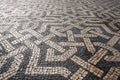 Geometric Pattern of Traditional Mosaic Tiles on Pavement in Lisbon, Portugal Royalty Free Stock Photo