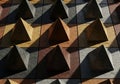 Geometric pattern of triangular shapes with varied textures and shadow play Royalty Free Stock Photo