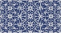 Geometric pattern with white stars and triangles on a blue background Royalty Free Stock Photo