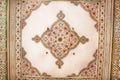 Geometric patterns on the ceiling of an old building in Indian style