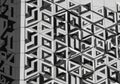 Geometric patterns create a striking facade with three-dimensional triangular shapes repeated Royalty Free Stock Photo