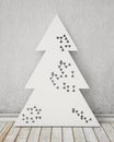 Geometric perforated modern design Christmas tree in vintage room, background