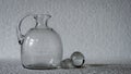 A geometric, rectangular patterned clear glass vase.