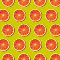 Geometric Red Orange Fruit Slices Pattern On Green Color Background
