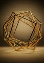 A geometric sculpture composed of interconnected gold tubes, forming a complex Royalty Free Stock Photo