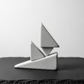 Shapes, resembling a stylized boat, are stacked with careful Royalty Free Stock Photo