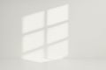 Geometric Shadows of a Window Casting Light Across a Minimalist White Interior Royalty Free Stock Photo