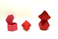 Geometric shape cut out of red paper and photographed on white. Hexagonal Dipyramid, Hexagonal prism, Cuboctahedron
