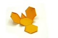 Geometric shape cut out of yellow paper and photographed on white background.Geometry net of Truncated tetrahedron