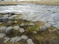 Some geometric shaped stones in Iceland, Kirkjugolf. The ground is made of basaltic rocks. Royalty Free Stock Photo