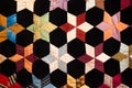 Geometric shapes and details on colorful fabric quilt