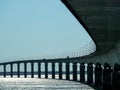 Geometric shapes of the seascape with a huge bridge connecting the shores.