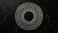 Geometric silver wireframe circle abstract sculpture on dark marble background Royalty Free Stock Photo