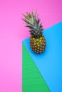 Geometric still life with pineapple on a colored background