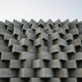 Geometric structure of interlocking rectangular concrete blocks, creating a repetitive, Royalty Free Stock Photo