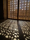Geometric Sunlight Patterns Through Ornate Window Royalty Free Stock Photo
