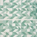 Geometric tile pattern showcasing light green and white triangles arranged to create Royalty Free Stock Photo