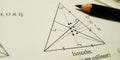 geometric triangle displayed with black pencil isolated